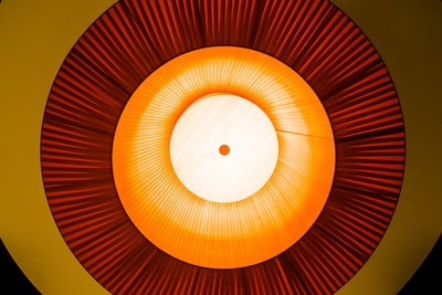 Orange and white round the lamp
